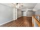Spacious bonus room offers hardwood floors and a built-in bookshelf at 7675 Rose Ln, Cumming, GA 30040