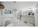 Luxurious bathroom featuring a soaking tub, glass shower, double vanity, and shiplap walls at 1152 Hampton Ne Way, Atlanta, GA 30324