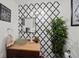 Stylish bathroom with a unique vessel sink, patterned wallpaper, modern lighting, and decorative accents at 1152 Hampton Ne Way, Atlanta, GA 30324