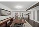 Bright dining room featuring a long wooden table, bench, and shuffleboard game, perfect for entertaining guests at 1152 Hampton Ne Way, Atlanta, GA 30324