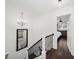 Bright hallway featuring a chandelier and a staircase with iron balusters leading to the second floor at 1152 Hampton Ne Way, Atlanta, GA 30324