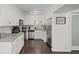 Bright kitchen with white cabinets, stainless steel appliances, granite counters, and hardwood floors at 1152 Hampton Ne Way, Atlanta, GA 30324