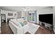 Comfortable living room with a large sectional sofa, hardwood floors, and natural light from the sliding glass doors at 1152 Hampton Ne Way, Atlanta, GA 30324