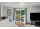 Bright living room with a large TV and easy access to a patio at 1152 Hampton Ne Way, Atlanta, GA 30324