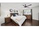 Spacious bedroom with wood floors, ceiling fan, three decorative mirrors, and natural light at 1152 Hampton Ne Way, Atlanta, GA 30324