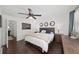 Comfortable bedroom with hardwood floors, ceiling fan, decorative mirrors, and natural light at 1152 Hampton Ne Way, Atlanta, GA 30324
