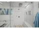 Luxurious glass enclosed shower with marble tiles, rainfall shower head and convenient built-in bench at 1152 Hampton Ne Way, Atlanta, GA 30324