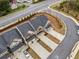 Aerial view of townhomes illustrating proximity to roadways and landscaping at 1307 Park Center Cir, Austell, GA 30168