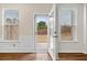 French doors offer easy access to the backyard from this hardwood floor living space at 1307 Park Center Cir, Austell, GA 30168