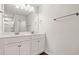 Well-lit bathroom featuring double sinks, modern fixtures, and ample storage below for convenience at 1307 Park Center Cir, Austell, GA 30168