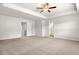 Spacious bedroom with neutral carpet and a tray ceiling for a luxurious feel and enhanced appeal at 1307 Park Center Cir, Austell, GA 30168