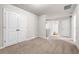 Upstairs bonus room has ample closet space with neutral carpet at 1307 Park Center Cir, Austell, GA 30168