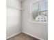Practical closet featuring carpet, window, and wire rack shelving for organized storage space at 1307 Park Center Cir, Austell, GA 30168