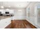 Bright dining area with hardwood floors, modern lighting, and a door to the outside at 1307 Park Center Cir, Austell, GA 30168
