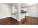 Dining area with hardwood floors, decorative wainscoting, and modern chandelier at 1307 Park Center Cir, Austell, GA 30168