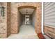 Arched entryway with brick and siding, leading to the front door at 1307 Park Center Cir, Austell, GA 30168