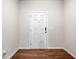Closed white front door with a secure lock on an entryway with hardwood floors at 1307 Park Center Cir, Austell, GA 30168