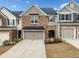 Charming brick townhome with a one-car garage and well-maintained landscaping at 1307 Park Center Cir, Austell, GA 30168