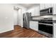 Modern kitchen with stainless steel appliances and granite countertops at 1307 Park Center Cir, Austell, GA 30168