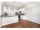 Open kitchen layout with granite counters, white cabinets, and stainless steel appliances at 1307 Park Center Cir, Austell, GA 30168
