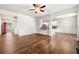 Open-concept living room showcasing wood floors and access to kitchen and front entry at 1307 Park Center Cir, Austell, GA 30168