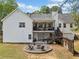 Back of home with deck and firepit area, ideal for outdoor entertaining and relaxation at 24 Scarlett Oak Ne Dr, Cartersville, GA 30121
