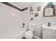 Charming bathroom with tub, decorative mirror, and cute wall decorations at 24 Scarlett Oak Ne Dr, Cartersville, GA 30121