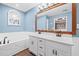 Beautiful bathroom with dual sinks, a soaking tub and a large mirror at 24 Scarlett Oak Ne Dr, Cartersville, GA 30121