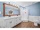 Modern bathroom featuring dual sinks, a shower and decorative wood trim at 24 Scarlett Oak Ne Dr, Cartersville, GA 30121