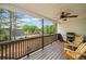 Covered deck offers seating, grilling area, and ceiling fan for comfortable outdoor living at 24 Scarlett Oak Ne Dr, Cartersville, GA 30121