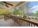 Spacious deck with wood railings offers beautiful backyard views and ceiling fan at 24 Scarlett Oak Ne Dr, Cartersville, GA 30121