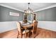 Traditional dining room with decorative lighting, hardwood floors and wainscoting at 24 Scarlett Oak Ne Dr, Cartersville, GA 30121