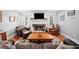 Cozy living room featuring a stone fireplace and classic decor at 24 Scarlett Oak Ne Dr, Cartersville, GA 30121