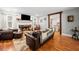 Open-concept living room with hardwood floors, fireplace, and rustic wood trim at 24 Scarlett Oak Ne Dr, Cartersville, GA 30121