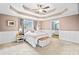 Spacious main bedroom with a tray ceiling, carpet and a bathroom ensuite at 24 Scarlett Oak Ne Dr, Cartersville, GA 30121