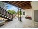 Relaxing outdoor patio with stairs, heat lamp, and a view of the backyard fire pit at 24 Scarlett Oak Ne Dr, Cartersville, GA 30121