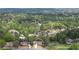 Aerial view of the home surrounded by mature trees in a desirable residential neighborhood at 4455 Sirrocco Sw Ln, Lilburn, GA 30047