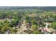 Aerial view of the neighborhood with winding streets and well-maintained homes in a wooded setting at 4455 Sirrocco Sw Ln, Lilburn, GA 30047