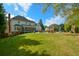 A beautiful, expansive backyard with a pool, patio, and a well-manicured lawn at 4455 Sirrocco Sw Ln, Lilburn, GA 30047