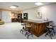 Wet bar area in the basement complete with sink, storage, and seating for entertaining at 4455 Sirrocco Sw Ln, Lilburn, GA 30047