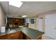 Basement area with a wet bar and ample seating, perfect for entertaining at 4455 Sirrocco Sw Ln, Lilburn, GA 30047