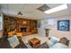 Basement features a brick fireplace with built-in shelves and comfortable seating for movie viewing at 4455 Sirrocco Sw Ln, Lilburn, GA 30047