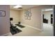 Basement features exercise equipment, neutral carpet and access to other finished spaces at 4455 Sirrocco Sw Ln, Lilburn, GA 30047