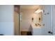 Bright bathroom has a walk-in shower, a long vanity, and access to other rooms in the home at 4455 Sirrocco Sw Ln, Lilburn, GA 30047