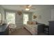 This light gray bedroom features modern decor, neutral carpet and natural light at 4455 Sirrocco Sw Ln, Lilburn, GA 30047