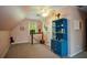 Bedroom featuring a sloped ceiling, blue dresser, and lots of natural light at 4455 Sirrocco Sw Ln, Lilburn, GA 30047