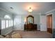 Spacious bedroom features a window with shutters and a door that leads to another room at 4455 Sirrocco Sw Ln, Lilburn, GA 30047