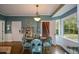 Bright breakfast nook with blue accents and view to backyard at 4455 Sirrocco Sw Ln, Lilburn, GA 30047