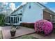 Charming home exterior with a screened porch and lovely landscaping at 4455 Sirrocco Sw Ln, Lilburn, GA 30047