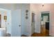Entryway features white paneled walls and hardwood floors, with doorways into adjoining rooms at 4455 Sirrocco Sw Ln, Lilburn, GA 30047